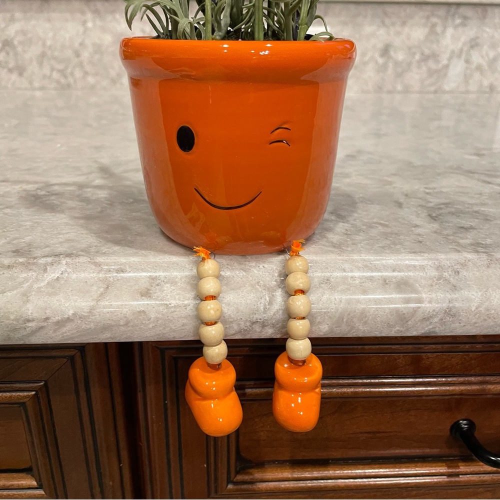 Swinging Happy Planter with Smiling Winky Face and Faux Lavender Potted Plant
